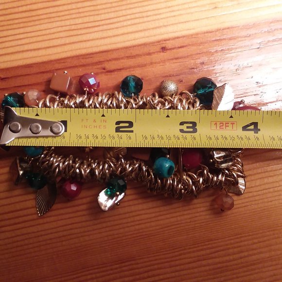 Gold stretch bracelet with charms - Picture 5 of 5